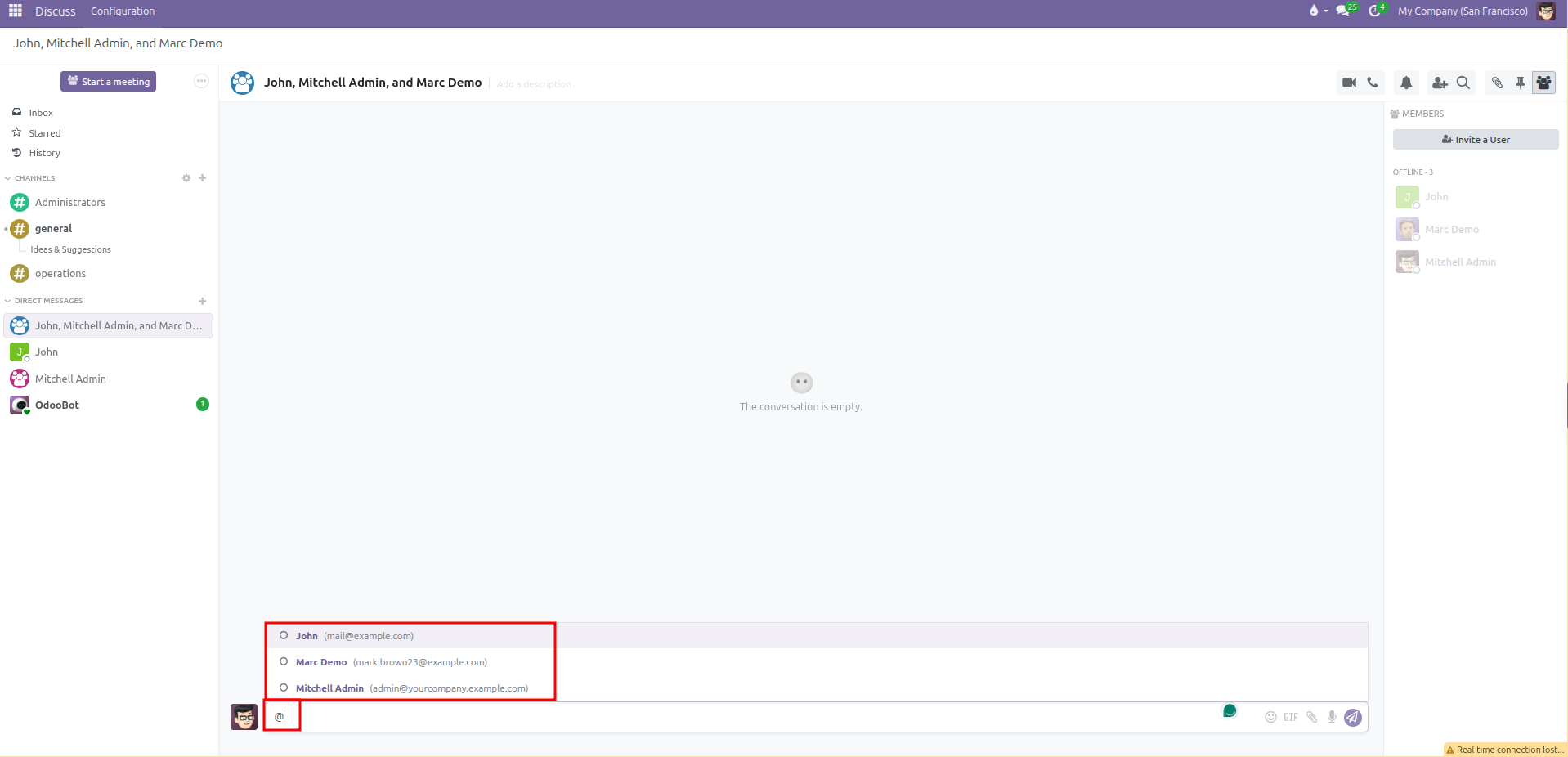 Composer showing user mention dropdown with availability circles and email addresses
